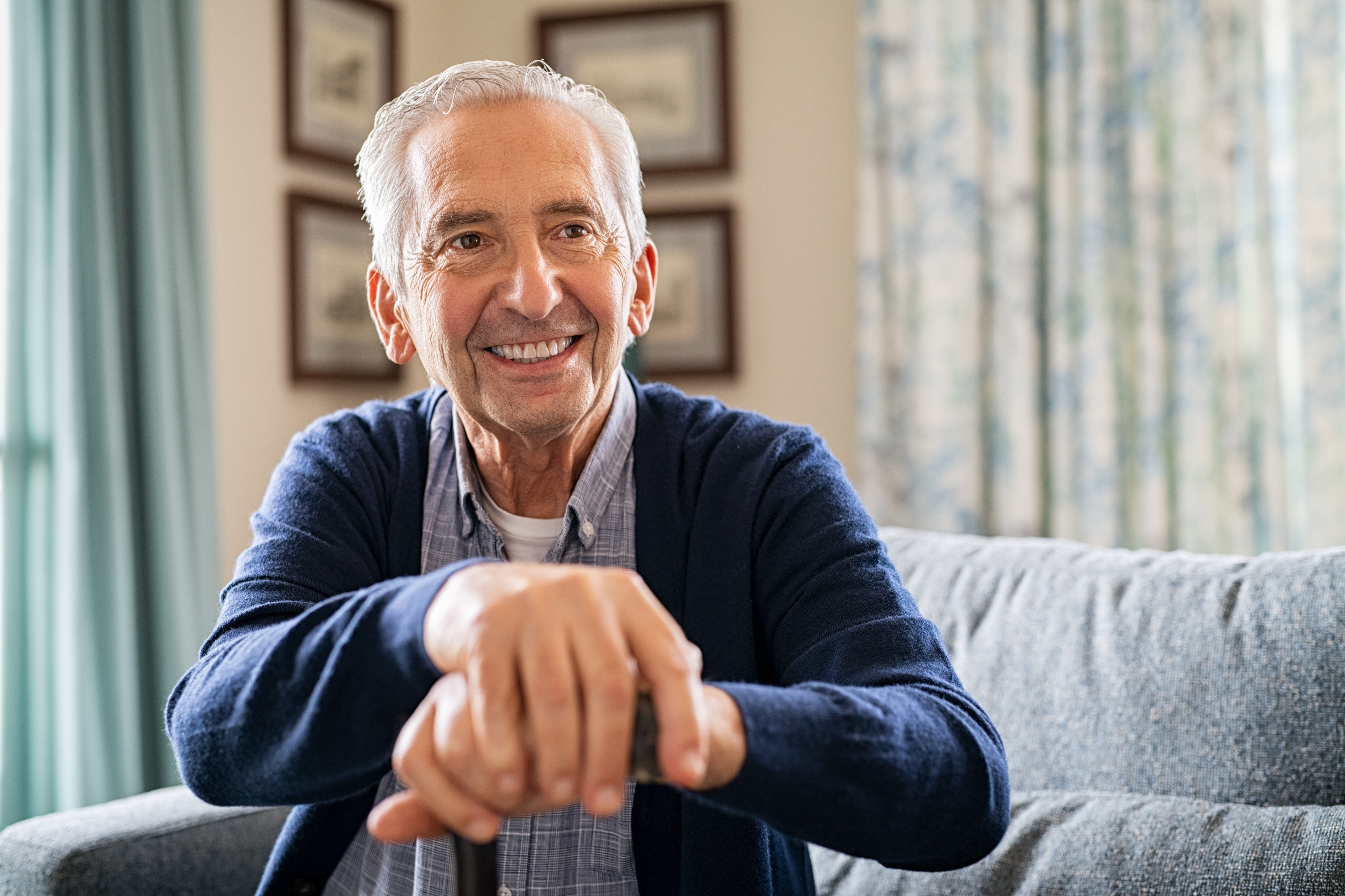 Happy Elderly Man Holding Walking Cane